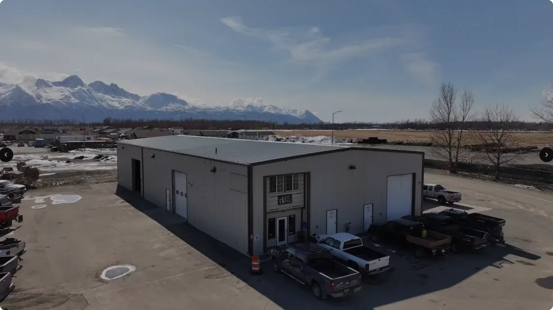Aerial view of the 1023 Diesel & Fleet shop in Palmer with mountains in the background.
